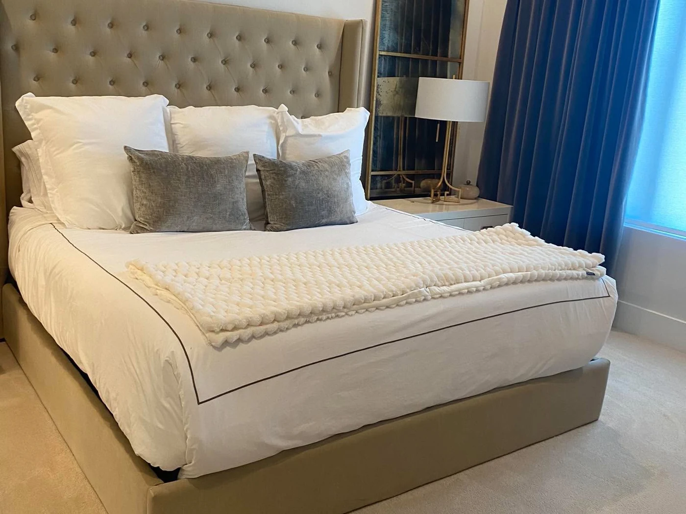 Freshly cleaned bedroom with neatly made bed