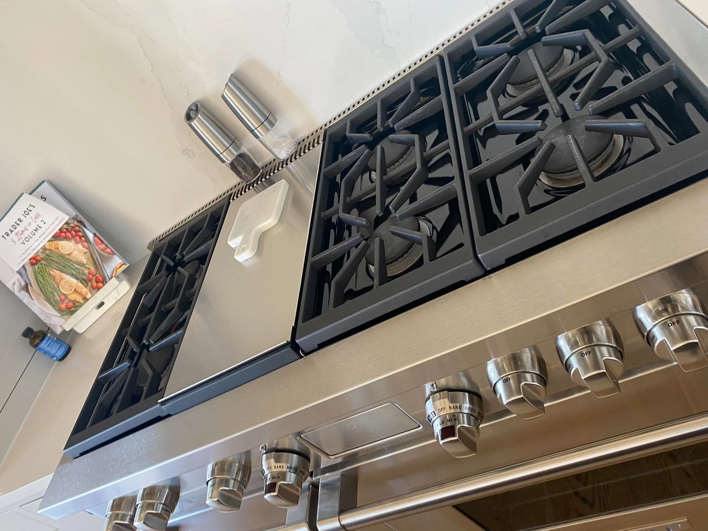 Freshly cleaned stainless steel kitchen stove and cooktop